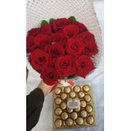 Bouquet of red roses and box of Ferrero Rocher chocolates