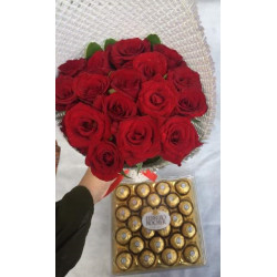 Bouquet of red roses and box of Ferrero Rocher chocolates