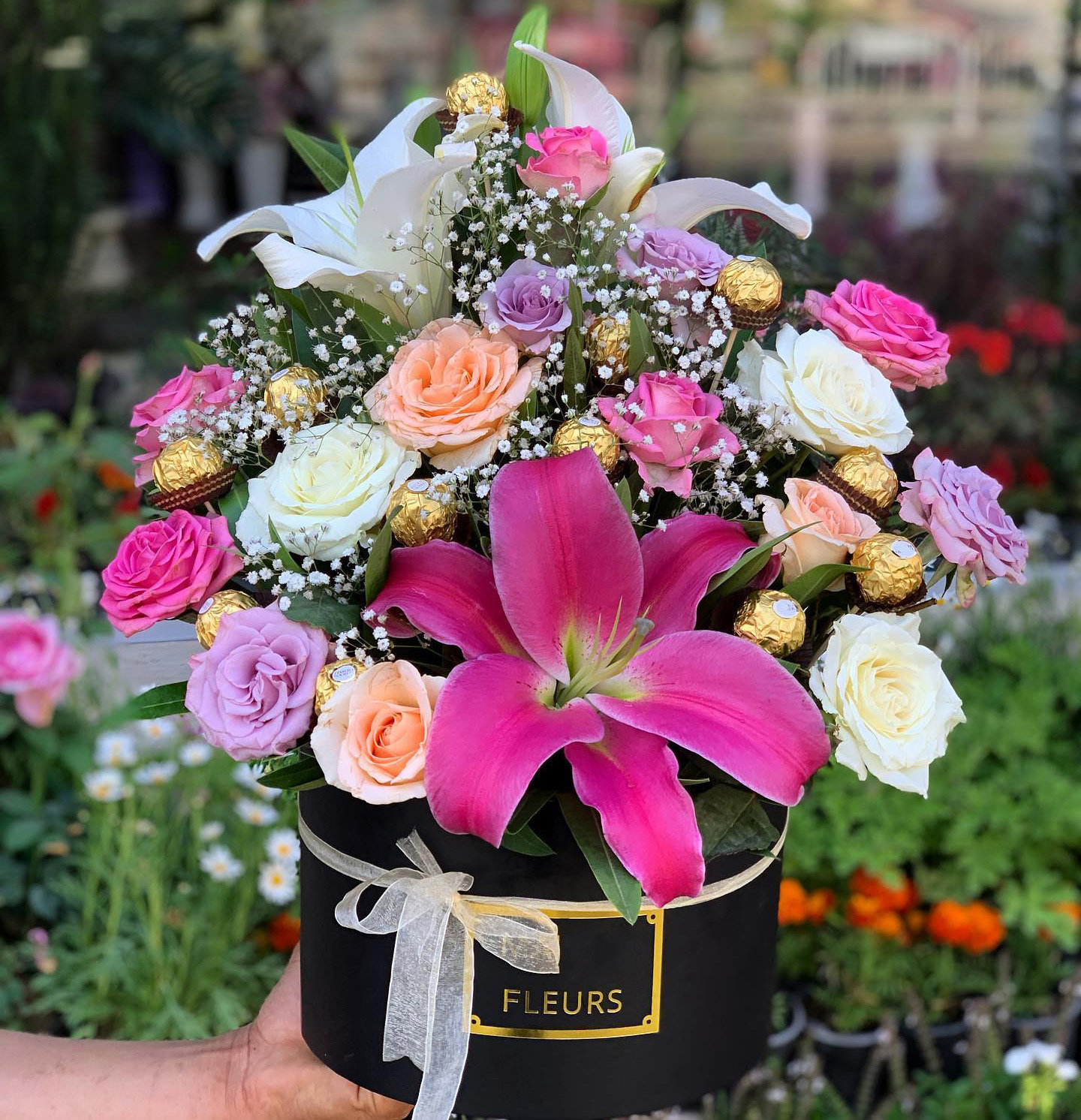 Box of colorful Flowers and Chocolate